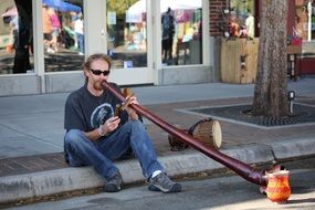 street musician with didgeridoo