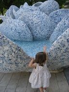 girl looking at fountain