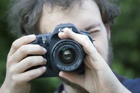 adult man shoots canon