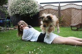 dog jumps over the girl