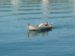 fishermen in a boat on the sea in Greece