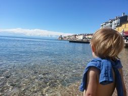 child at sea on a sunny day