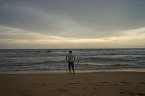 man on beach in evening time