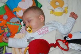 baby sleeping with pacifier