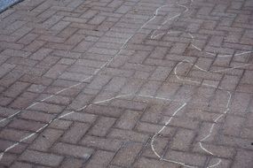chalk outline on the ground after crime scene