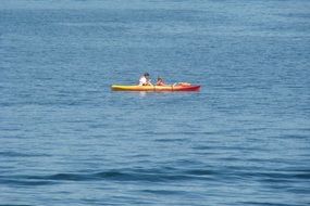 red kayak in the middle of the river