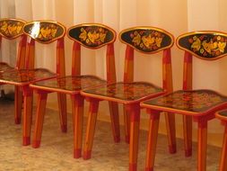 wooden chairs in colorful style hohloma