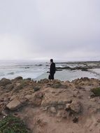 man by beach shore