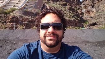 selfie of a young man with a beard in sunglasses