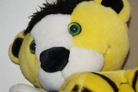 yellow and white soft tiger toy