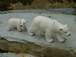 white bears, cub and adult, stone figures