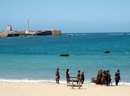 people in historical costumes on beach, Spain, Andalusia