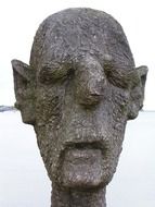 wooden sculpture of a head close up