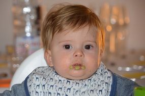 a child with a dirty mouth while eating