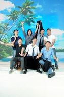 group of happy asian men on tropical beach, studio shot
