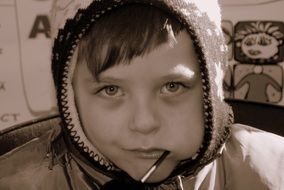 Portrait of the boy with candy