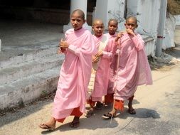 girls in pink clothes in a monastery