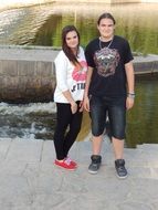 sister and brother by river