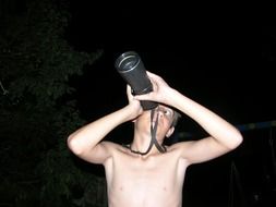 portrait of the man drinks water at night
