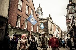 gothic costumed people on old town street, whitby goth weekend