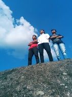 friends on a big rock