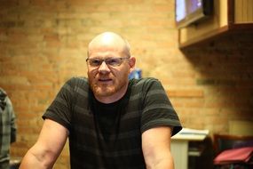 bald man in glasses