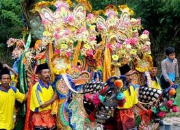people with colorful decorations on carnival, indonesia, java
