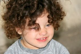 nice curly-haired child with blue eyes