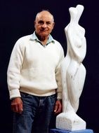 the man and the sculpture of marble