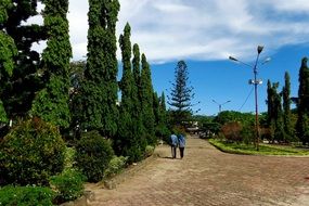 muslim couple walking together in park