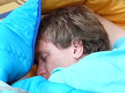 man sleep in sleeping bag