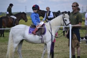 child on a pony in competitions