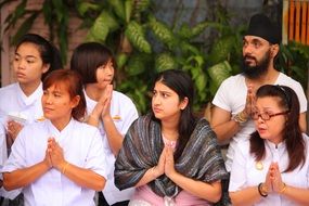 praying buddhist in Thailand
