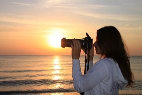 female photographer on the beach