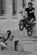 breathtaking stunt on a bicycle on a background of the photographer