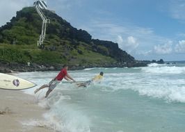 Surfing in the ocean on Hawaii