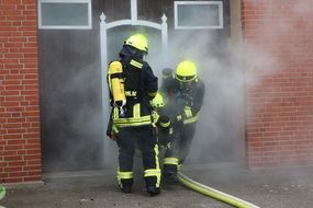 two specialists extinguish a fire