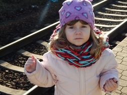 little girl near railway