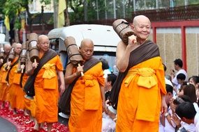 a lot of buddhists bald monks at the ceremony