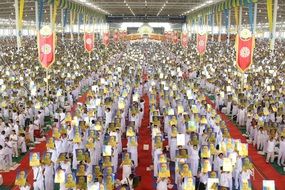 buddhists crowd meditating ceremony