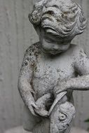 Stone sculpture of small child