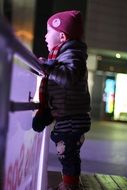 chinese boy by the fence