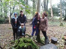 boys and girls play in the forest