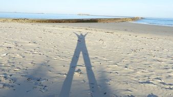 shadow man in sand