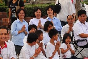 praying asian people, buddhism