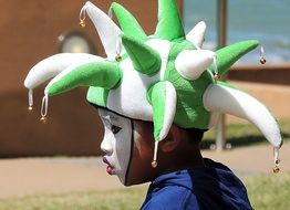 boy in joker carnival costume