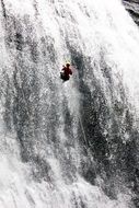 rappelling in the waterfall