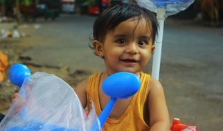 indian child on a baby bike