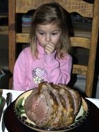 Girl is eating the prime rib