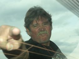 man points his finger at the subject